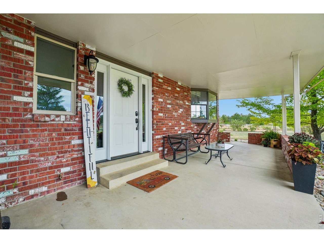 Property Photo 4 Covered front porch welcomes you and guests!