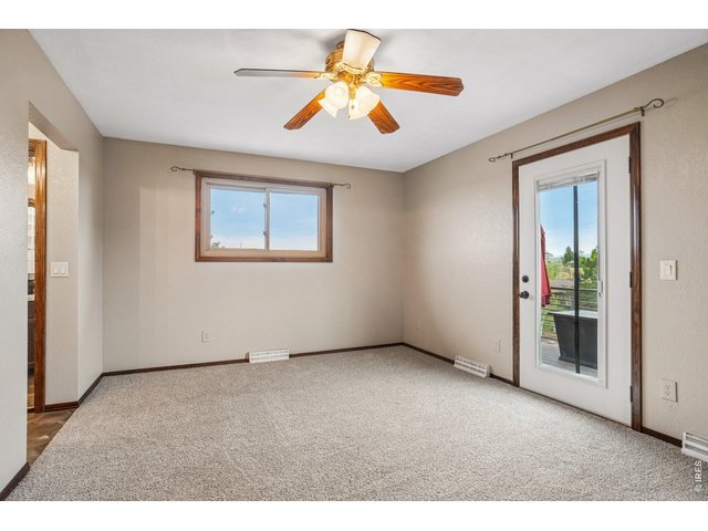 Property Photo 17 Primary bedroom has west facing patio with mountain view and sunsets