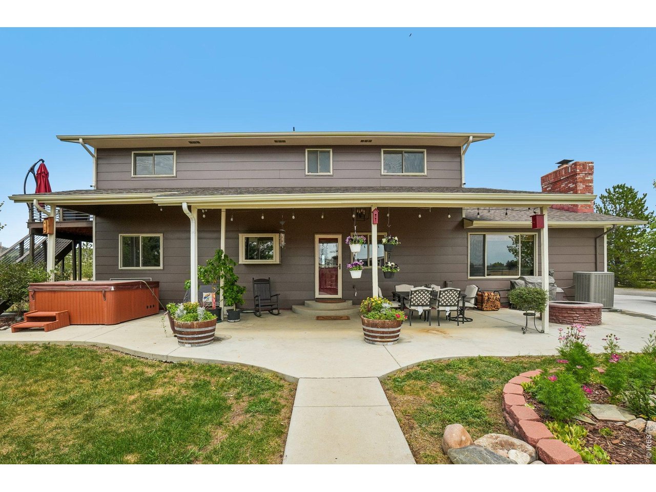 Property Photo 43 Covered back porch, plenty of space for outdoor living. Hot tub included!