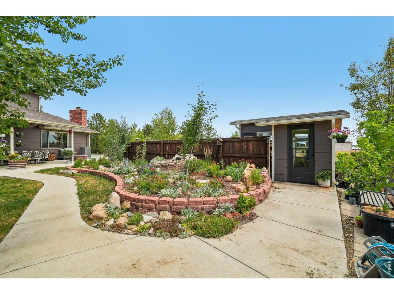 Property Photo 45 Water feature and tons of feature landscaping, greenhouse on the right side