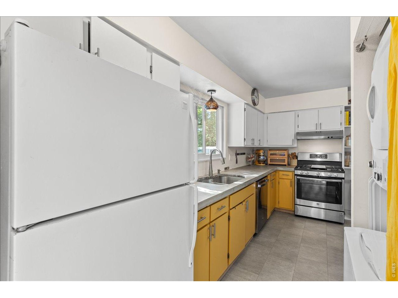 Property Photo 11 Two tone kitchen offers dimension and style