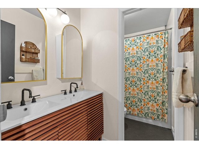 Property Photo 27 Updated full bathroom with privacy door between vanity and bathtub/toilet room