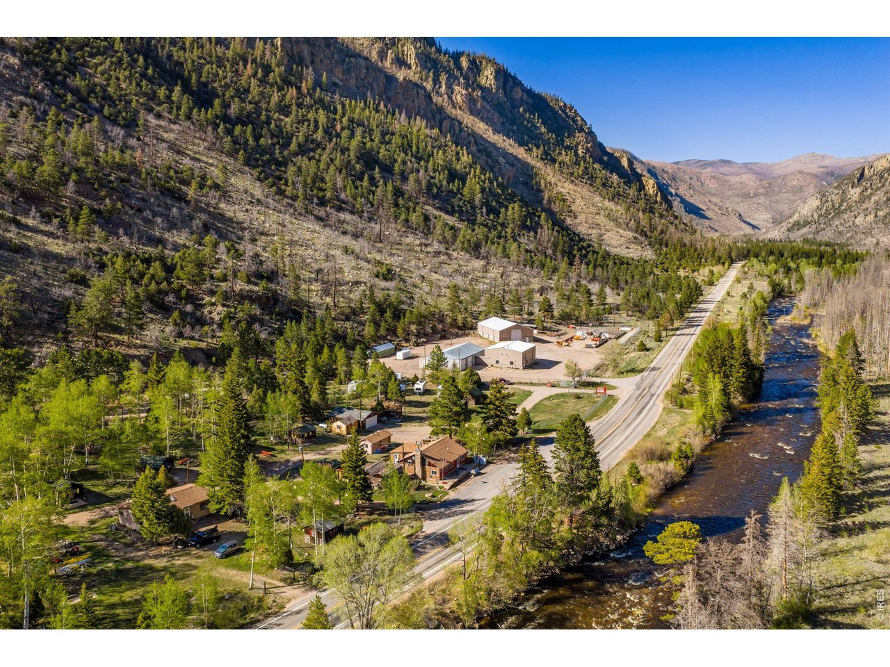 Property Photo 4 1 residence, 10 RV spots (ability to have more), 12 fully furnished cabins, retail shop & 2nd home (previous restaurant), park, pond, picnic benches and soooooo much more.