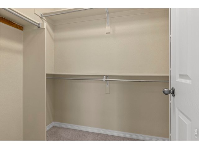 Property Photo 16 primary bedroom walk in closet