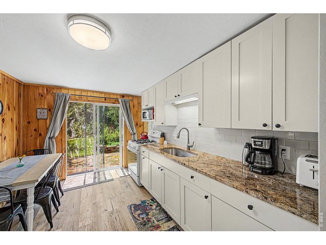 Property Photo 11 Updated kitchen with granite and high end cabinets