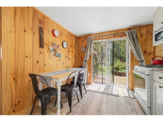 Property Photo 15 Extension of your kitchen space-Step out to the large flag stone patio, next to the river.