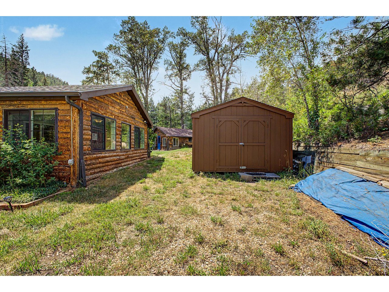 Property Photo 23 Right side of the cabin is the large shed/workshop.