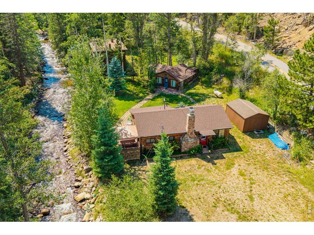 Property Photo 3 Great for fishing, entertaining, or just relaxing to sound of the water flowing by.