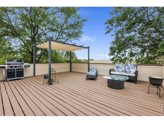 Property Photo 36 Huge backyard deck with retractable covered pergola looking out west