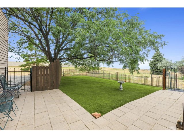 Property Photo 37 Fenced backyard space with astroturf and patio