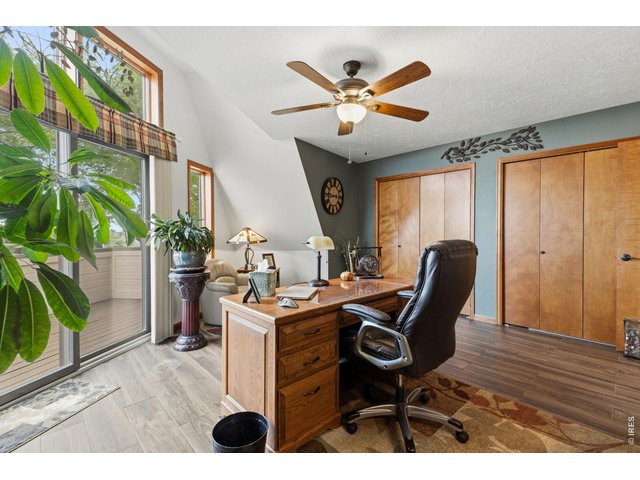 Property Photo 20 Main level bedroom/office with walkout to balcony