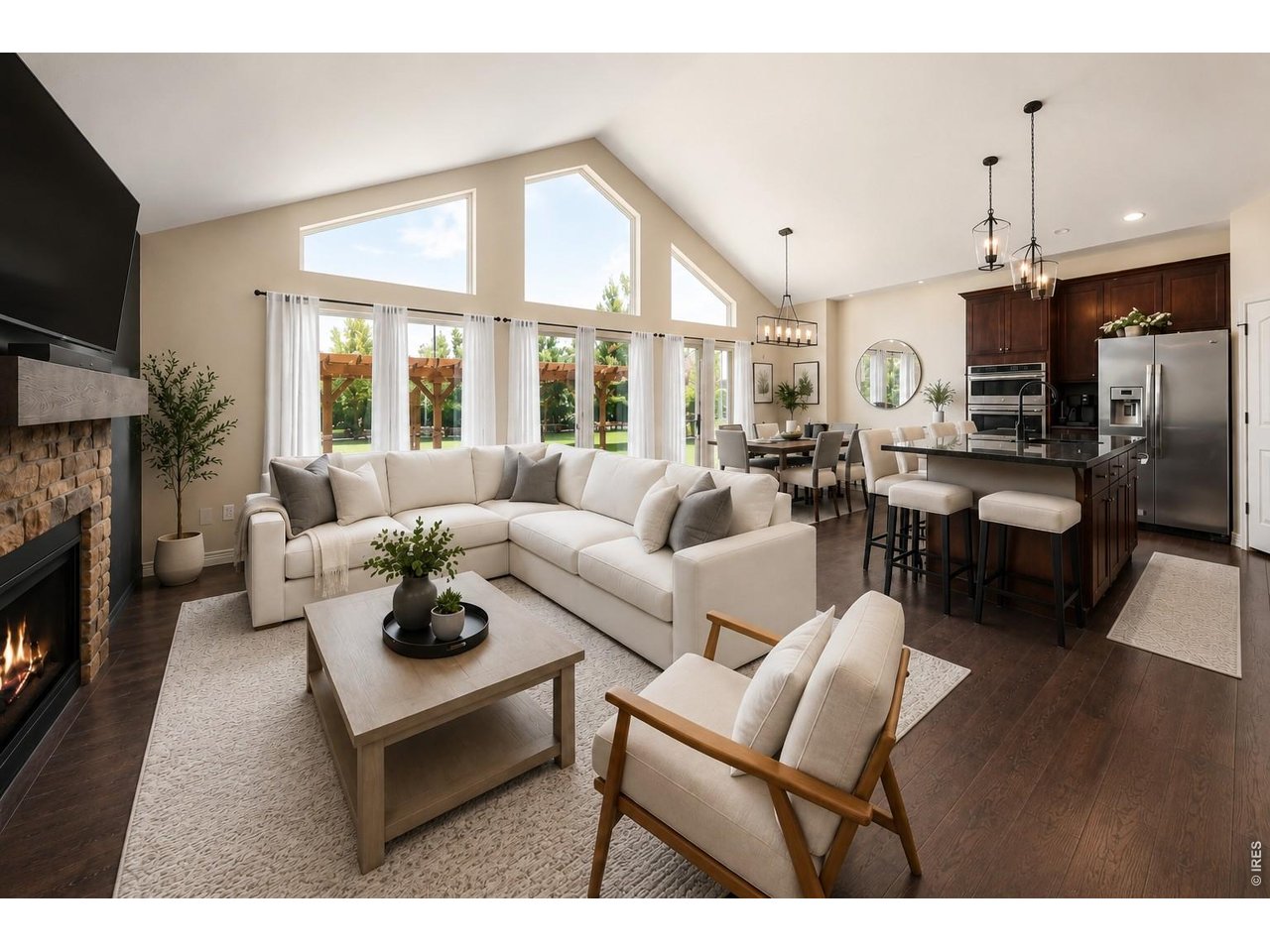 Property Photo 4 Great Room with Expansive Windows to the Back & Vaulted Ceilings!