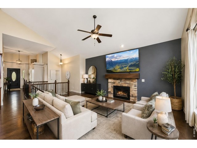 Property Photo 5 Gas Stone Fireplace, Open Floor Plan Living! Wood Flooring in Much of Main Floor