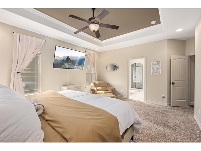 Property Photo 15 Main Floor Primary Bedroom Opens to Full 5 Piece Bath & Large Walk In Closet