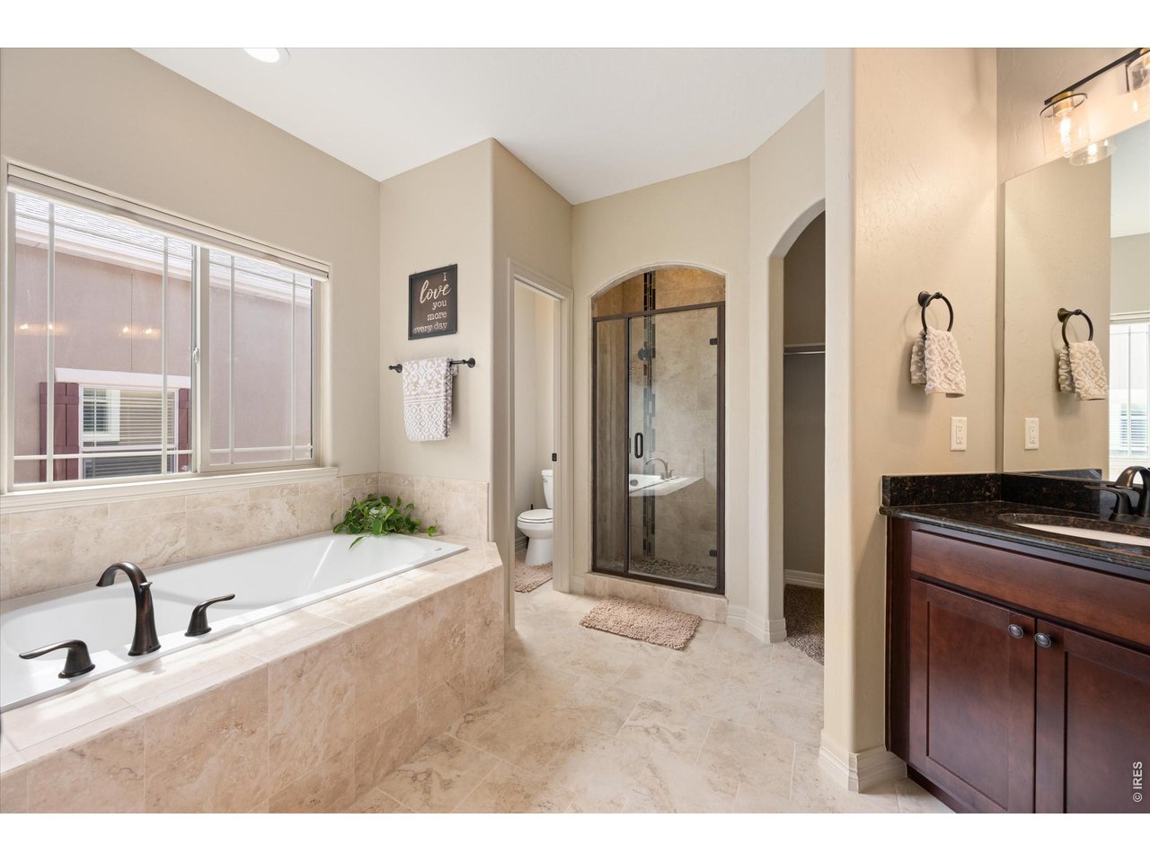 Property Photo 16 Primary Full 5 Piece Bath-Tiled Flooring, Floor to Ceiling Tiled Shower & Soaking Tub