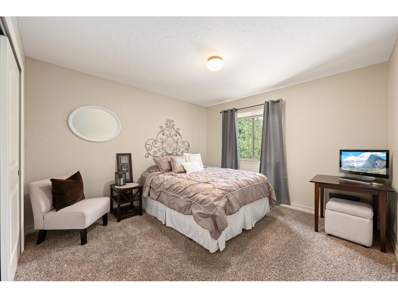 Property Photo 20 Secondary Main Floor Bedroom with Large Window to the Back!