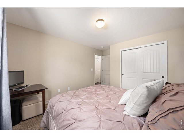 Property Photo 21 Secondary Bedroom has Large Closet. Additional 3rd Bedroom on Main Floor (Not Pictured) Has Walk In Closet!