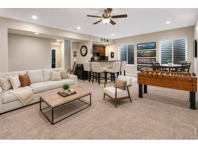 Property Photo 24 Family Room Opens to Rec Space & Full Bar Area