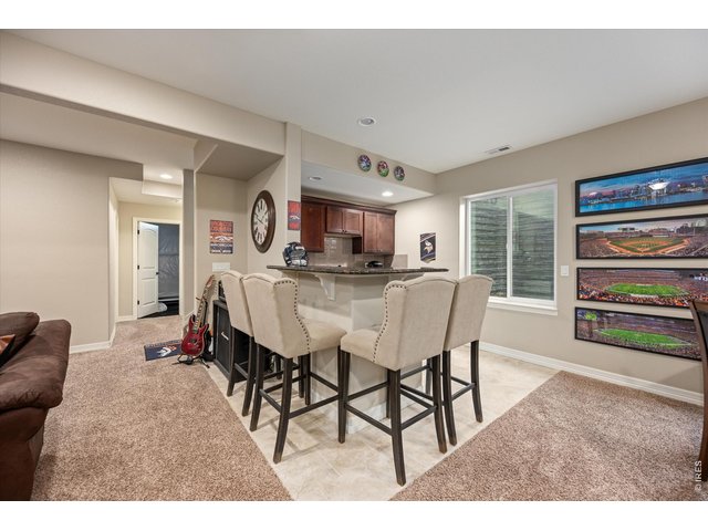 Property Photo 25 Basement Bar Complete with Granite Counters & Upper Cabinetry