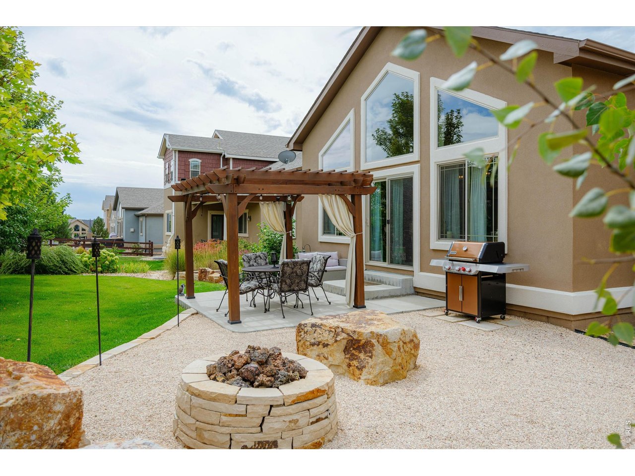 Property Photo 34 Welcome to your Outdoor Oasis! Gas Firepit with Tiki Torches Perfect for a Summer Evening!