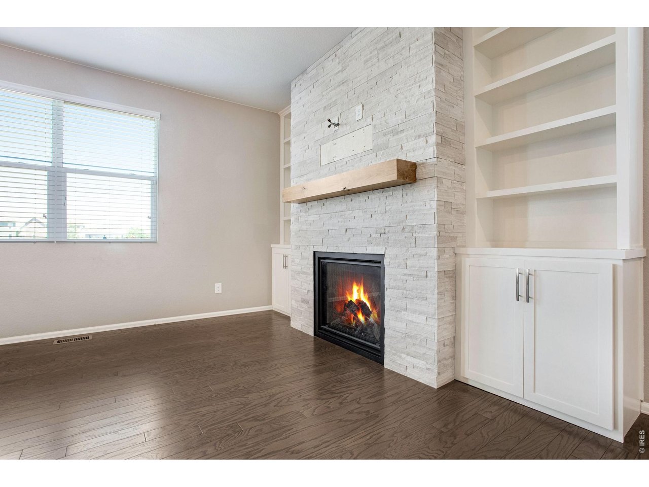 Property Photo 6 Beautiful custom gas fireplace and storage