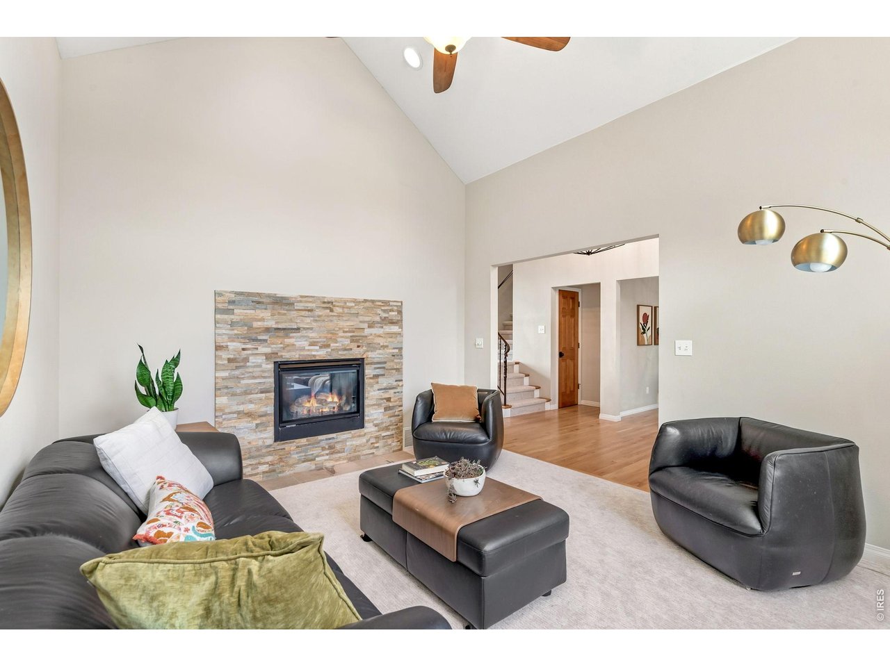 Property Photo 5 Inviting living room with rock fireplace off front entry. (14' x 12')