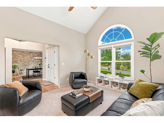 Property Photo 7 Living room offers great natural light off front entry. (14' x 12')