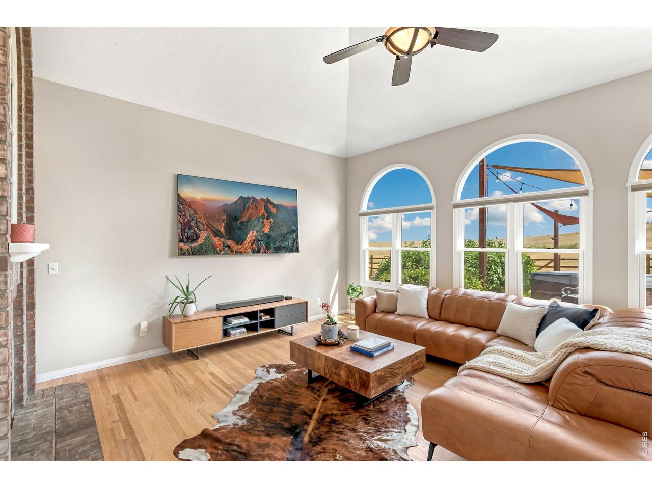 Property Photo 10 Soaring windows fill the family room with natural light and open your eyes to the space beyond. (20' x 15')