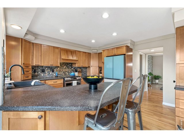Property Photo 16 Kitchen equipped with new gas range, refrigerator, sink, faucet, and disposal. All new. (13' x 11')