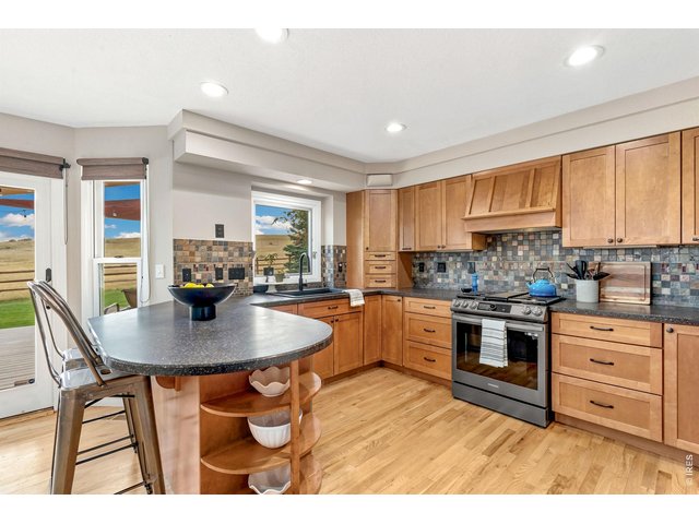 Property Photo 17 Kitchen features bar seating. (13' x 11')
