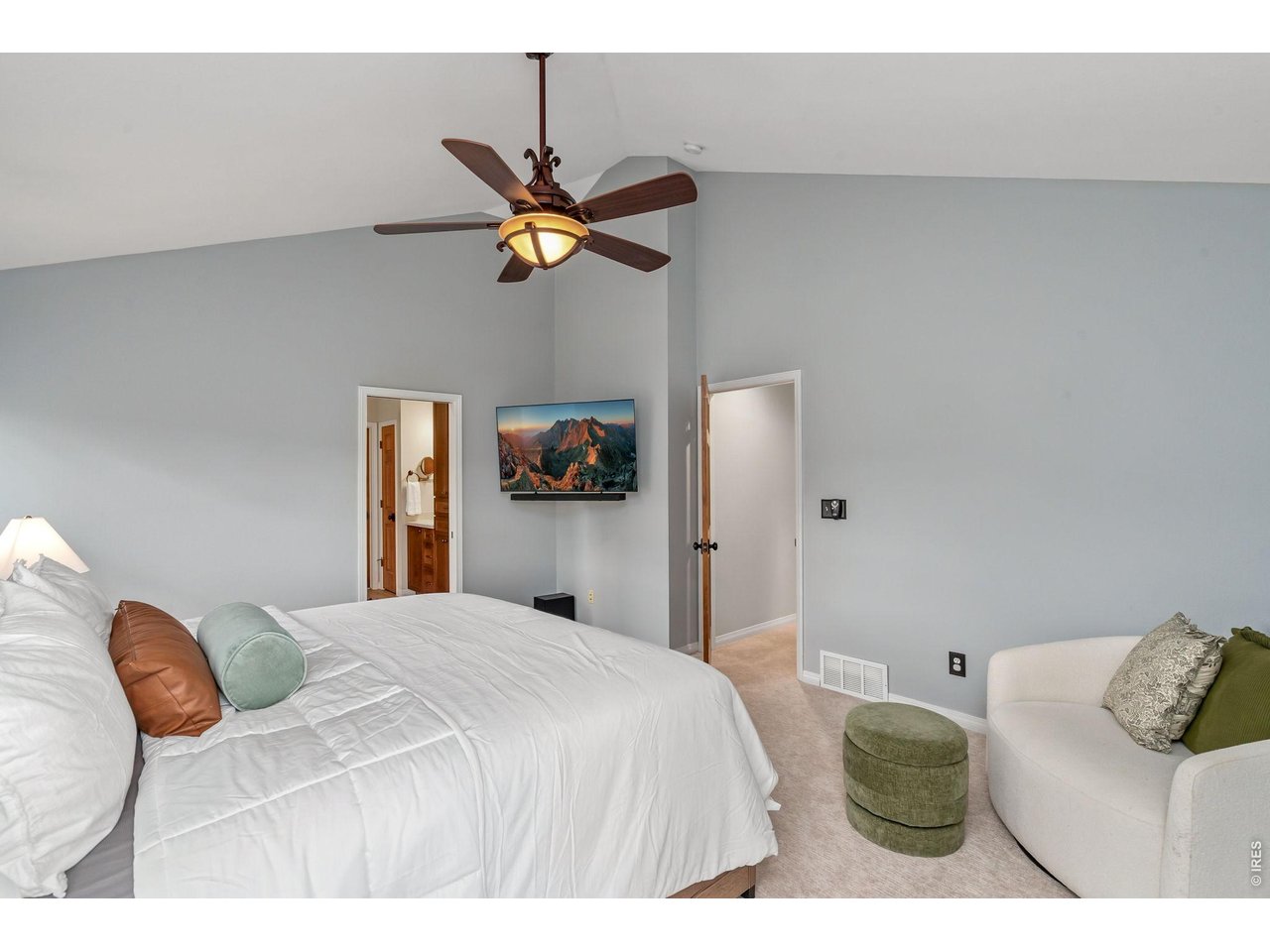 Property Photo 22 Primary bedroom on upper level with vaulted ceilings. (16' x 14')