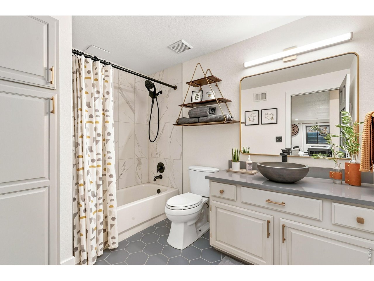 Property Photo 34 Newly updated full basement bathroom with tile and quartz vanity.