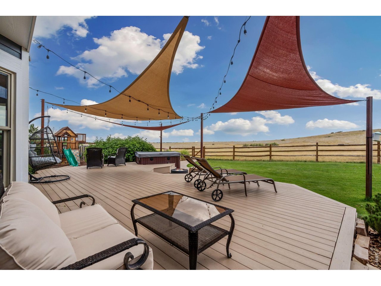 Property Photo 42 Sprawling multi-level deck over looking Cathy Fromme Prairie Open Space.