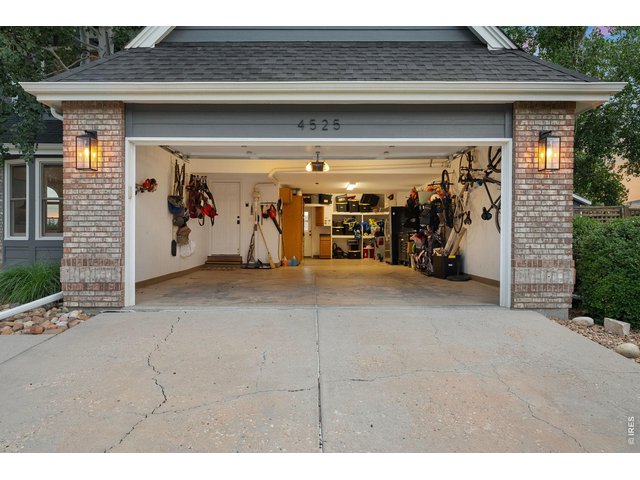 Property Photo 39 3-car tandem garage with built-in storage, entry to laundry room, and service door to the back yard deck.