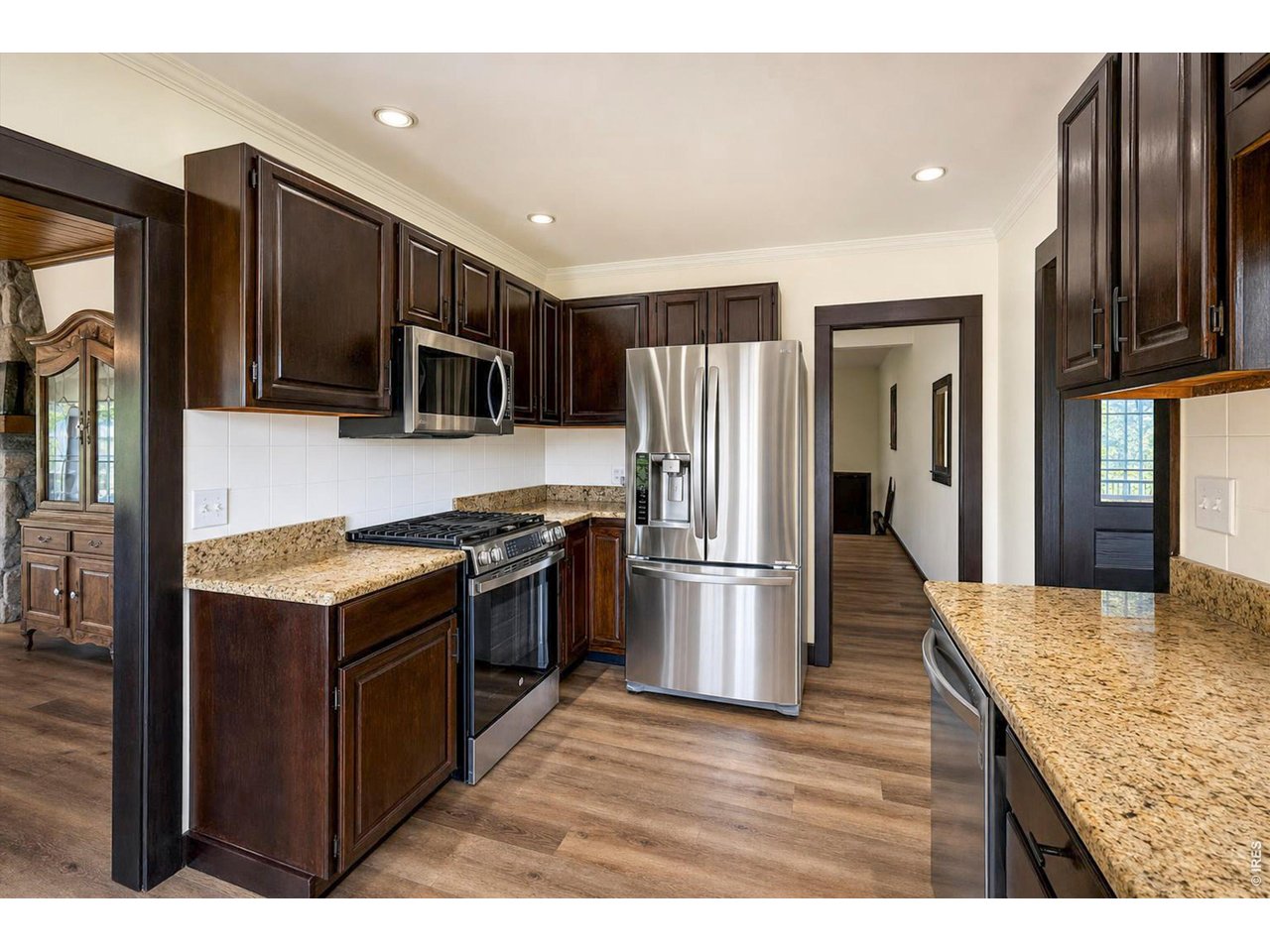 Property Photo 5 Granite and Stainless Steel complimented by the new flooring and paint
