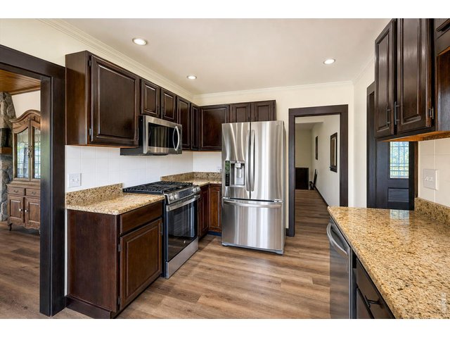 Property Photo 5 Granite and Stainless Steel complimented by the new flooring and paint