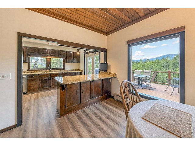 Property Photo 13 From dining room out that gorgeous picture window and towards the kitchen