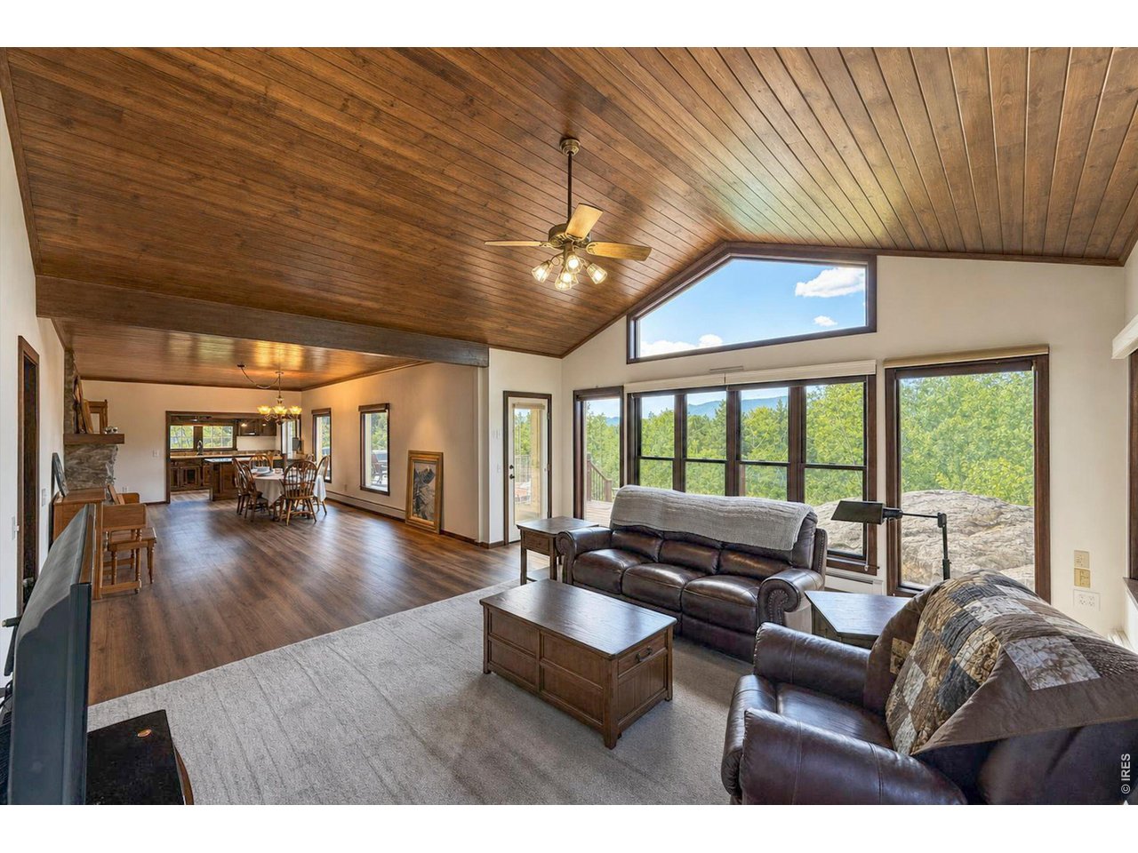 Property Photo 17 The family room is a cozy place with vaulted wood ceilings and a wall of windows