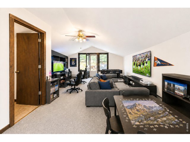 Property Photo 31 Upstairs loft virtually staged as a recreation room/family hub