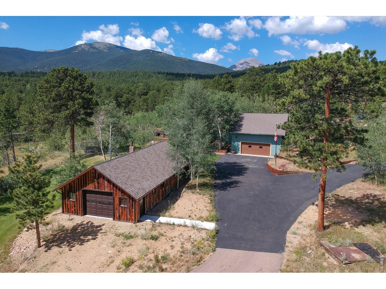Property Photo 45 Forest barn south entrance, paved driveway convergence and attached two car garage. Oh, and those gorgeous mountain views!