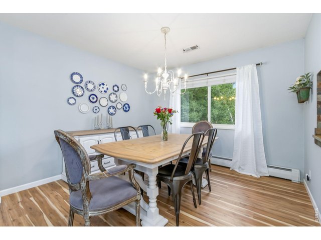 Property Photo 11 Dedicated dining space offers flexibility for everyday meals or special occasions.