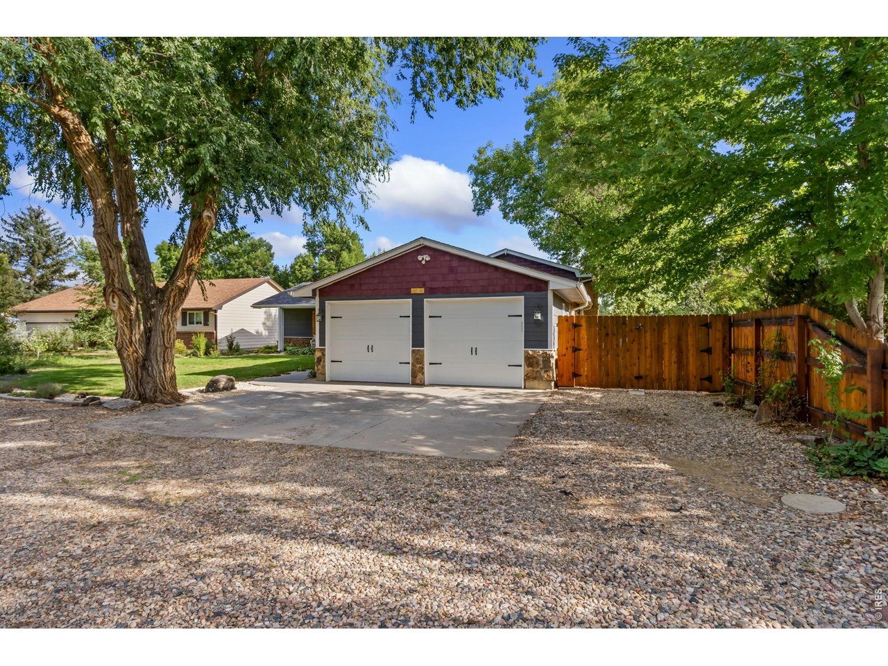 Property Photo 4 A rare attached 4-car tandem garage offers exceptional space for vehicles, storage, or hobbies.