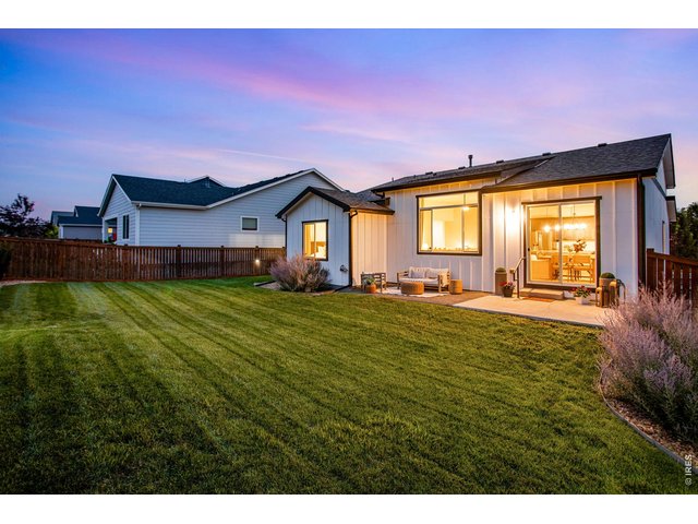 Property Photo 2 Lush Oversized Yard, full privacy fence and irrigation front and back. BRAND NEW Class IV Impact Resistant shingles + gutters, new driveway, loaded with customization.