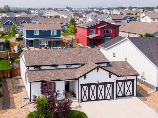 Property Photo 31 The list of thoughtful upgrades runs deep: a newer driveway, a partial finished basement (permitted in 2022) for extra flexible space, brand-new Class IV impact-resistant shingles and gutters, 92% efficiency furnace paired with central air.