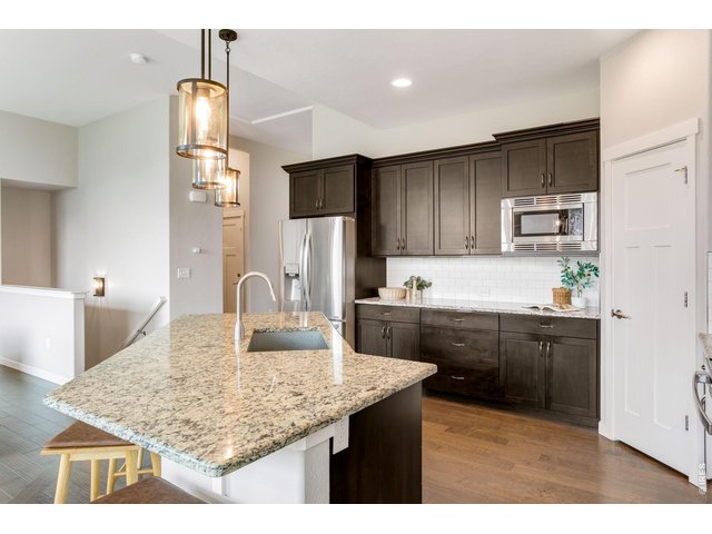 Property Photo 11 The eat-in kitchen, is perfectly paired with vast countertop & cabinetry space.