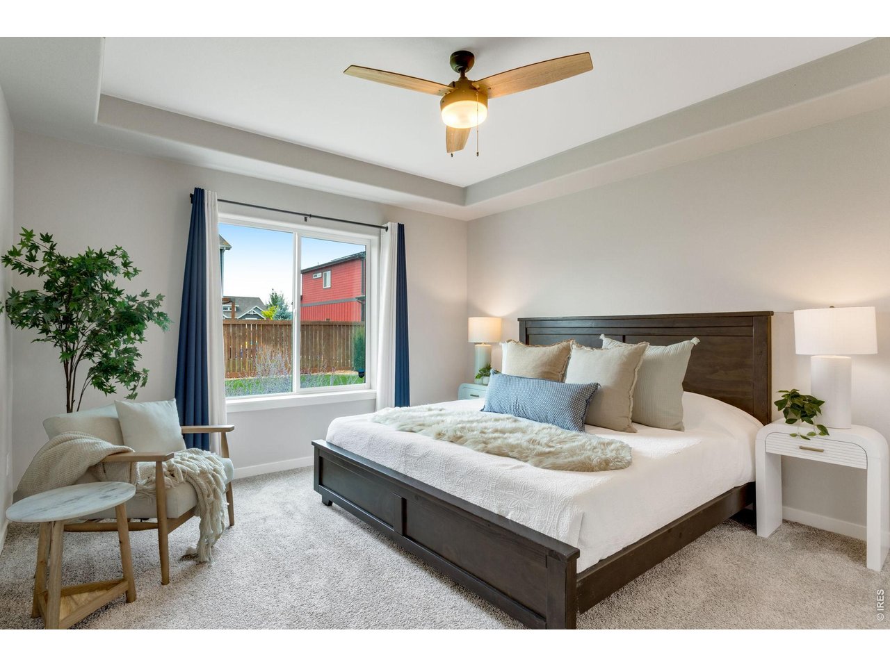 Property Photo 18 Primary Bedroom Suite, all bedrooms have ceiling fans and oversized picture windows.