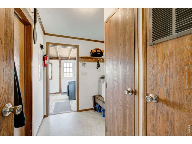 Property Photo 30 Back mud room with attached covered deck.
