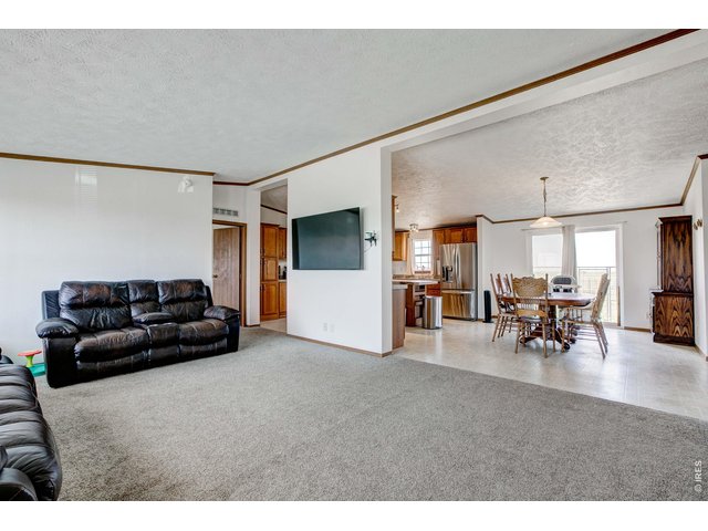 Property Photo 8 Front living room spills into large kitchen!