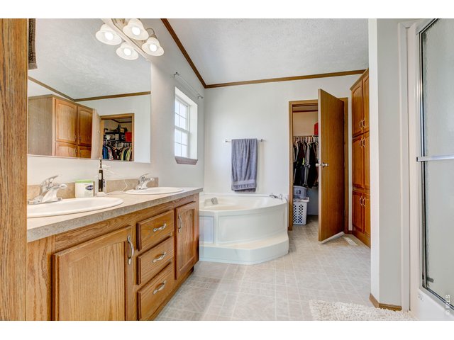 Property Photo 27 Large Primary with double sinks, tub, shower and walk in closet