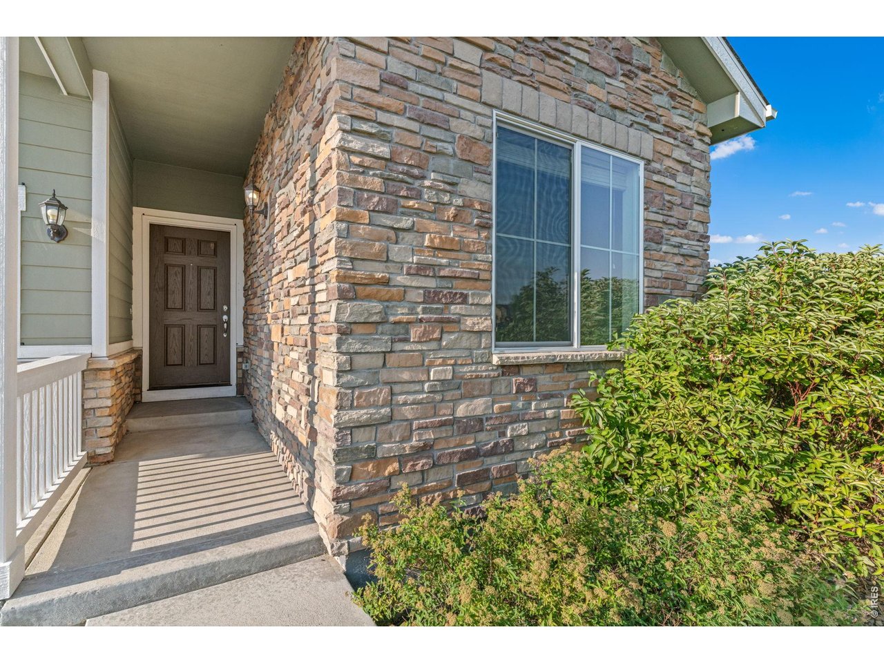 Property Photo 2 Beautiful stacked stone brings warmth to the exterior of the home.
